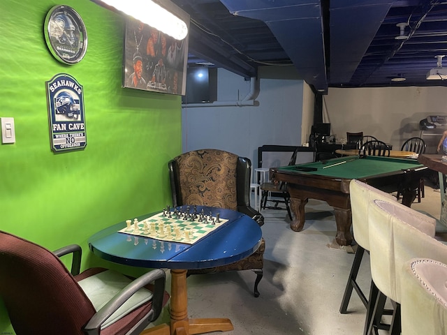 playroom featuring concrete flooring and billiards