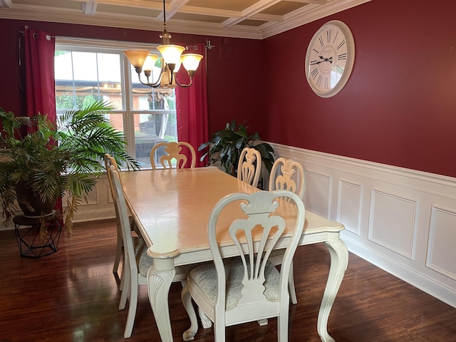 dining area featuring a chandelier, coffered ceiling, crown molding, dark wood-style floors, and beam ceiling