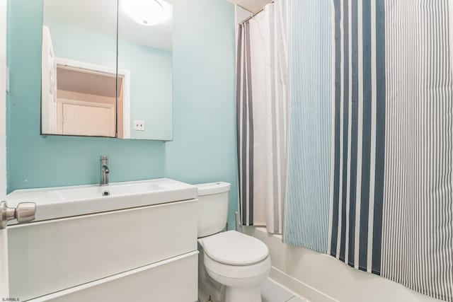 bathroom featuring toilet and vanity