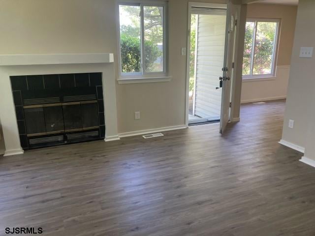 120 Heathercroft Unit 120, Egg Harbor Township, NJ 08234 - unfurnished living room featuring baseboards, a fireplace, and wood finished floors