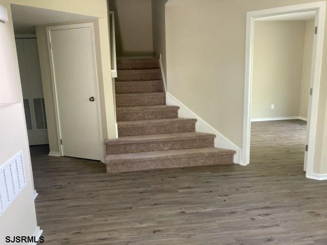 120 Heathercroft Unit 120, Egg Harbor Township, NJ 08234 - stairs with wood finished floors and baseboards