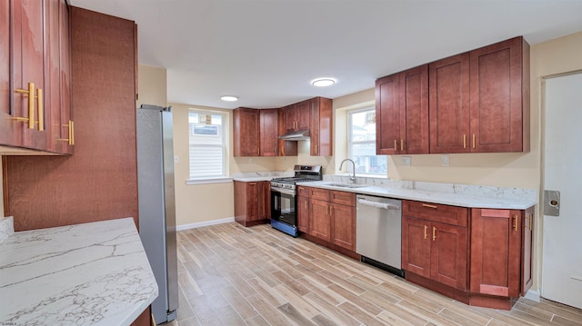 25 N Aberdeen Pl, Atlantic City, NJ 08401 - kitchen featuring appliances with stainless steel finishes, a sink, under cabinet range hood, baseboards, and light wood-style flooring