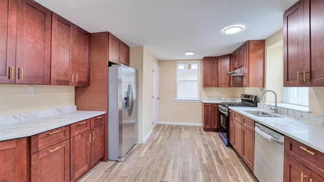 25 N Aberdeen Pl, Atlantic City, NJ 08401 - kitchen with stainless steel appliances, a sink, baseboards, light wood finished floors, and under cabinet range hood