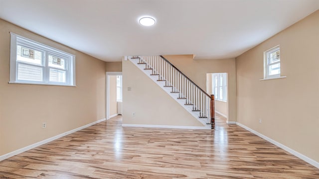 25 N Aberdeen Pl, Atlantic City, NJ 08401 - below grade area featuring light wood-style flooring, stairway, and baseboards