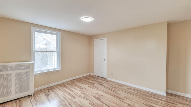 25 N Aberdeen Pl, Atlantic City, NJ 08401 - unfurnished room featuring radiator heating unit, light wood-type flooring, and baseboards