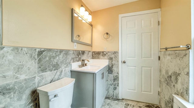 25 N Aberdeen Pl, Atlantic City, NJ 08401 - bathroom with tile walls, wainscoting, vanity, toilet, and marble finish flooring