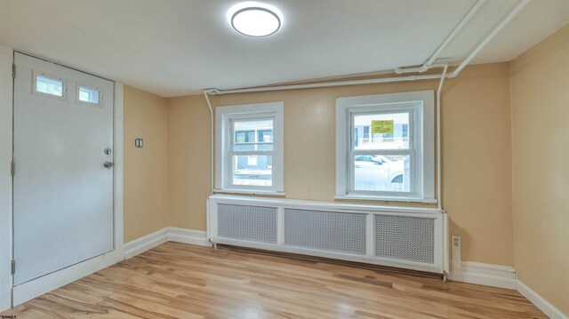 25 N Aberdeen Pl, Atlantic City, NJ 08401 - entrance foyer with radiator heating unit, light wood-style floors, and baseboards