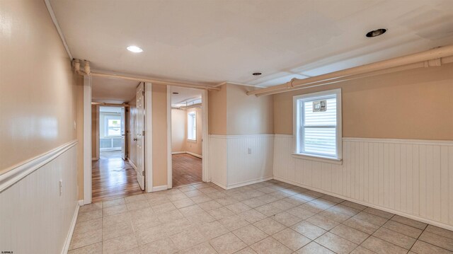 25 N Aberdeen Pl, Atlantic City, NJ 08401 - empty room with a wainscoted wall, light tile patterned flooring, and recessed lighting