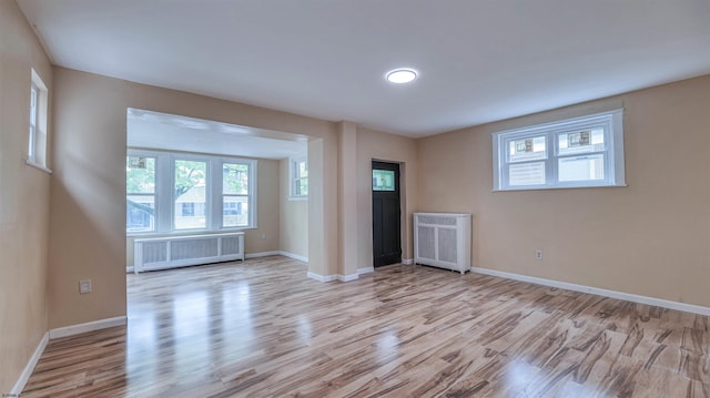 25 N Aberdeen Pl, Atlantic City, NJ 08401 - unfurnished living room with radiator heating unit, wood finished floors, and baseboards
