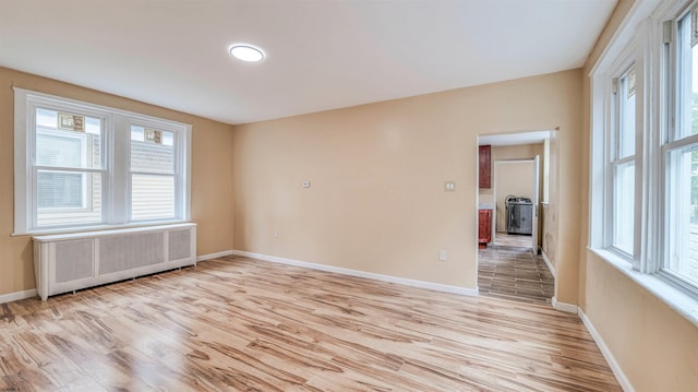 25 N Aberdeen Pl, Atlantic City, NJ 08401 - unfurnished room with radiator heating unit, light wood-style flooring, baseboards, and plenty of natural light