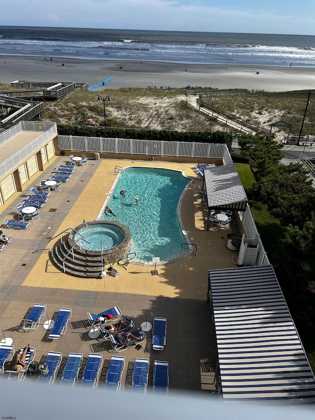 101 S Plaza Pl Unit 714, Lower Chelsea, NJ 08401 - community pool featuring view of water and beach, fence, and a patio area