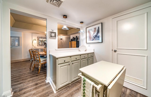 500 Bay Ave Unit 406S, Ocean City, NJ 08226 - kitchen with wood finished floors, pendant lighting, baseboards, and light countertops