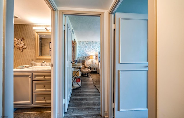 500 Bay Ave Unit 406S, Ocean City, NJ 08226 - corridor with wallpapered walls, a sink, and dark wood-type flooring