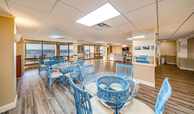 500 Bay Ave Unit 406S, Ocean City, NJ 08226 - dining space with wood finished floors, baseboards, and a drop ceiling