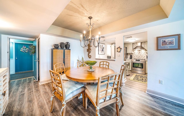 500 Bay Ave Unit 406S, Ocean City, NJ 08226 - dining space with wood finished floors, a chandelier, baseboards, and a textured ceiling