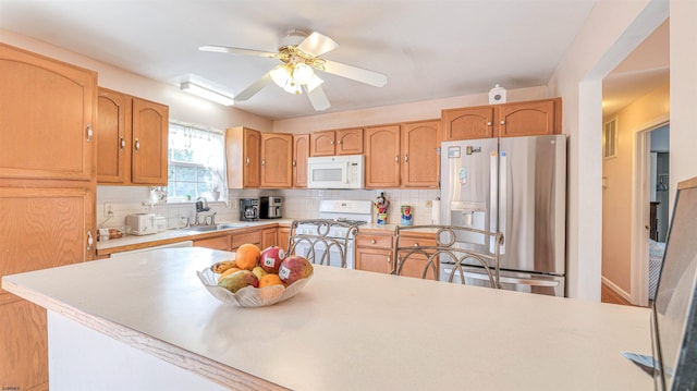 921 Navajo Ave, Absecon, NJ 08201 - kitchen with white appliances, a sink, light countertops, and backsplash