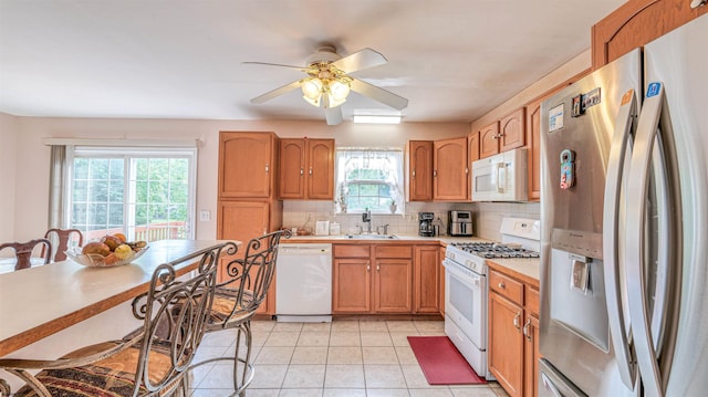 921 Navajo Ave, Absecon, NJ 08201 - kitchen with white appliances, a sink, light countertops, backsplash, and ceiling fan