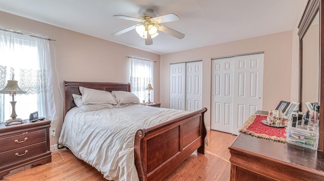 921 Navajo Ave, Absecon, NJ 08201 - bedroom featuring multiple closets, light wood-type flooring, and a ceiling fan