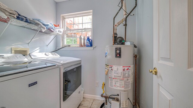 921 Navajo Ave, Absecon, NJ 08201 - laundry area featuring gas water heater, washing machine and dryer, and light tile patterned floors
