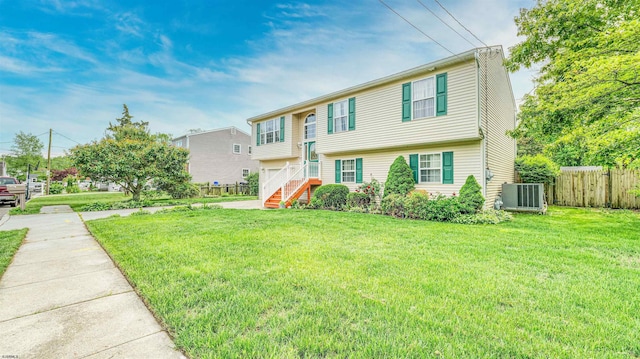 921 Navajo Ave, Absecon, NJ 08201 - view of front of house with cooling unit, a garage, driveway, and stairs