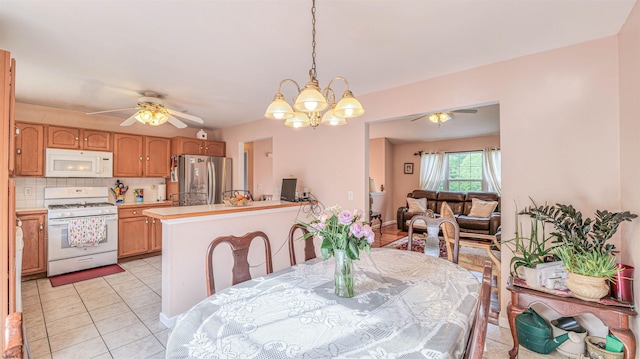 921 Navajo Ave, Absecon, NJ 08201 - dining area featuring ceiling fan, a chandelier, and light tile patterned floors