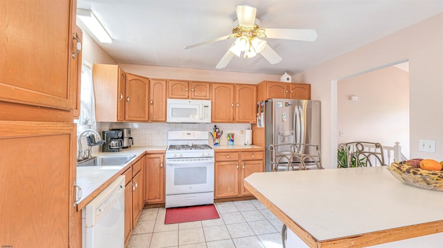 921 Navajo Ave, Absecon, NJ 08201 - kitchen with white appliances, a sink, light countertops, backsplash, and light tile patterned floors