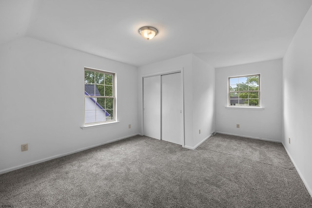 414A Upas Ave, Galloway Township, NJ 08205 - unfurnished bedroom with multiple windows, carpet flooring, a closet, and baseboards