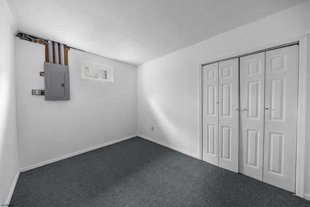 414A Upas Ave, Galloway Township, NJ 08205 - unfurnished bedroom with electric panel, dark colored carpet, baseboards, and a closet