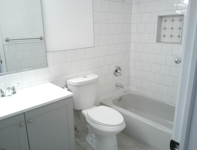 414A Upas Ave, Galloway Township, NJ 08205 - bathroom featuring tile walls, vanity, toilet, shower / bath combination, and tasteful backsplash