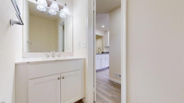 156 Rumson Dr Unit 156, Galloway Township, NJ 08205 - bathroom with two vanities and wood finished floors
