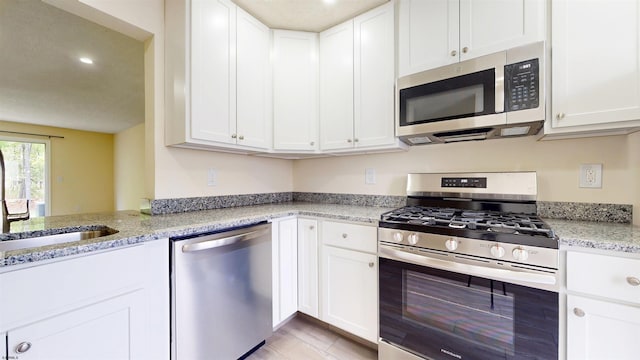 156 Rumson Dr Unit 156, Galloway Township, NJ 08205 - kitchen with appliances with stainless steel finishes, white cabinetry, a sink, and recessed lighting