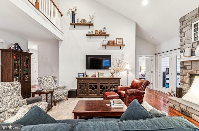 922 Central Ave, Hammonton, NJ 08037 - living room with high vaulted ceiling, wood finished floors, and a stone fireplace