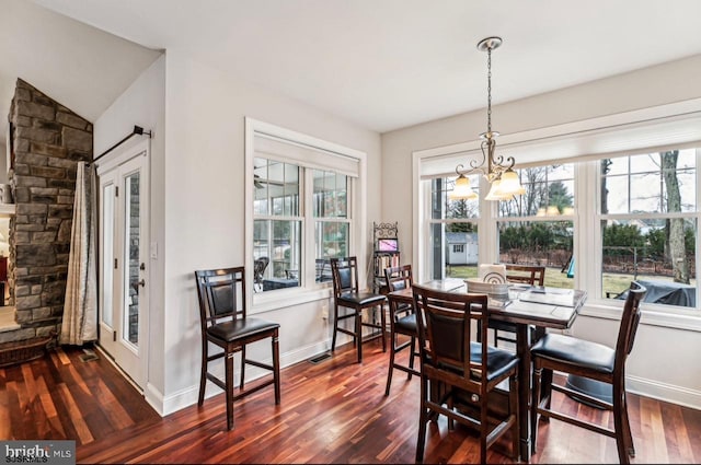 922 Central Ave, Hammonton, NJ 08037 - dining room with a chandelier, dark wood-style flooring, and baseboards
