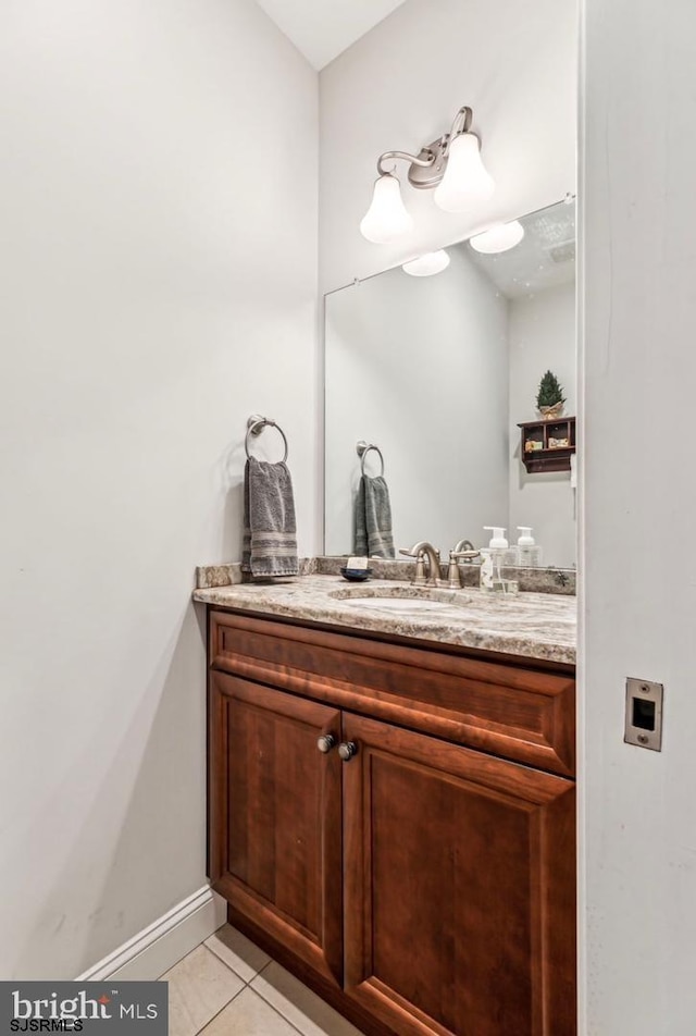 922 Central Ave, Hammonton, NJ 08037 - bathroom with tile patterned floors, vanity, and baseboards