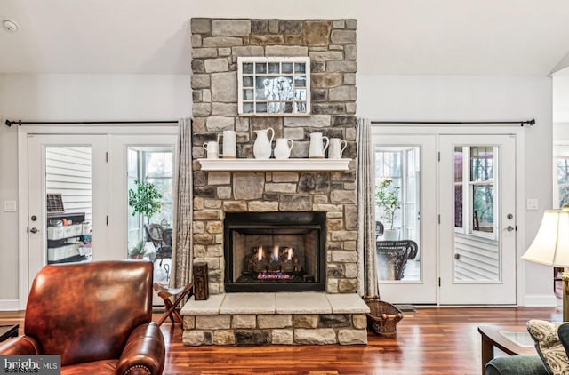 922 Central Ave, Hammonton, NJ 08037 - living room featuring wood finished floors and a stone fireplace