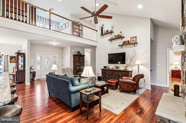 922 Central Ave, Hammonton, NJ 08037 - living room featuring a ceiling fan, dark wood finished floors, a high ceiling, baseboards, and a fireplace with raised hearth