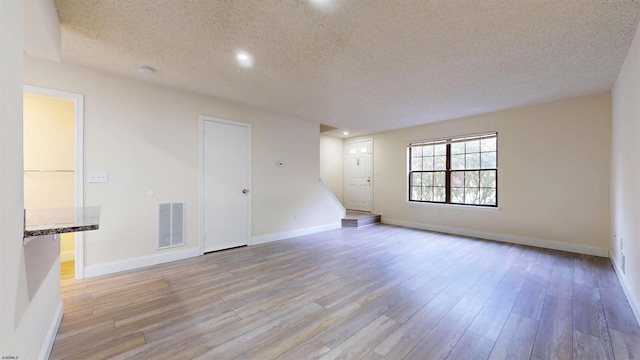 214 Mattix Run Unit 214, Galloway Township, NJ 08205 - empty room with a textured ceiling, light wood-style flooring, recessed lighting, baseboards, and a smoke detector