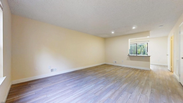 214 Mattix Run Unit 214, Galloway Township, NJ 08205 - empty room featuring light wood finished floors, recessed lighting, a textured ceiling, and baseboards
