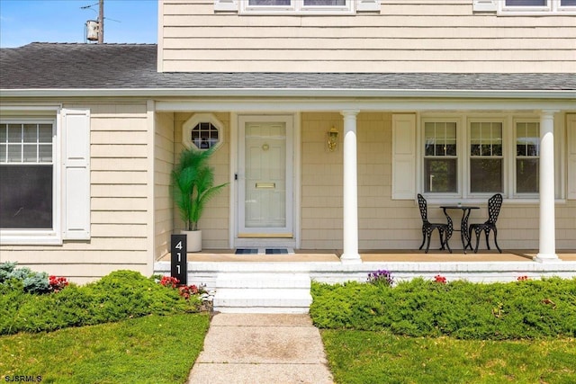 411 N Douglas Ave, Margate, NJ 08402 - doorway to property featuring a porch and a shingled roof
