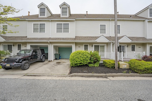 19 Clipper Ct, Atlantic City, NJ 08401 - view of property featuring driveway, an attached garage, and roof with shingles