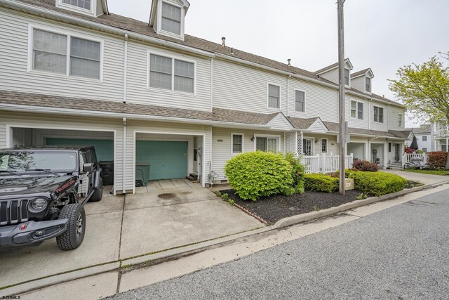 19 Clipper Ct, Atlantic City, NJ 08401 - townhome / multi-family property with a garage, concrete driveway, and a shingled roof