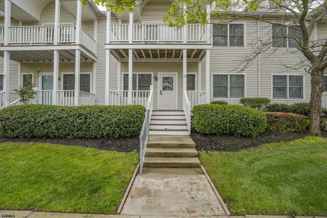 19 Clipper Ct, Atlantic City, NJ 08401 - view of front of property with a front lawn and a balcony