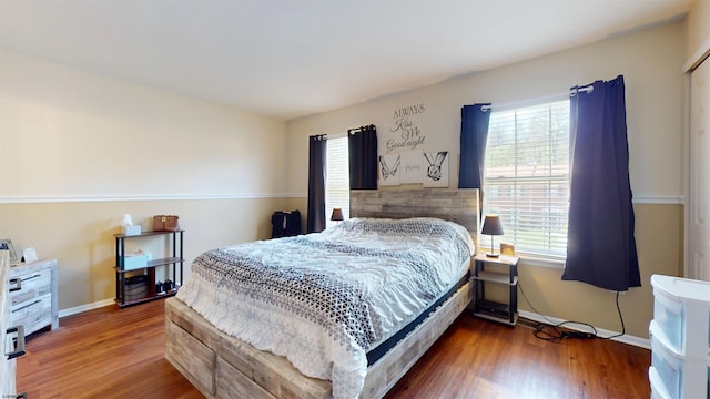 11 Cherokee Dr Unit 206, Galloway Township, NJ 08205 - bedroom with multiple windows, wood finished floors, and baseboards