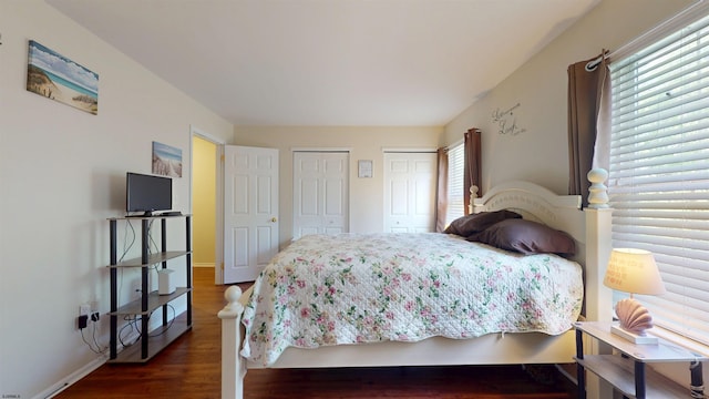 11 Cherokee Dr Unit 206, Galloway Township, NJ 08205 - bedroom featuring two closets, wood finished floors, and baseboards