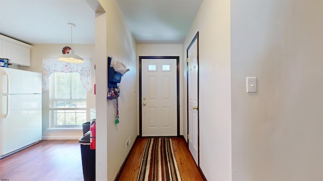 11 Cherokee Dr Unit 206, Galloway Township, NJ 08205 - doorway to outside with wood finished floors and baseboards