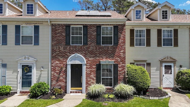 11 Cherokee Dr Unit 206, Galloway Township, NJ 08205 - townhome / multi-family property with solar panels, brick siding, and roof with shingles