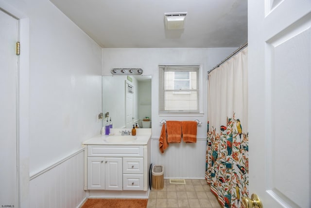 425 Central Ave Unit 1, Ocean City, NJ 08226 - bathroom with vanity, a wainscoted wall, and a shower with shower curtain