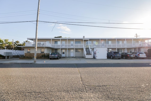 800 W Brigantine Ave Unit 209, Brigantine, NJ 08203 - view of property featuring uncovered parking and stairs