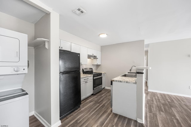 700 N Franklin Blvd Unit 1003, Pleasantville, NJ 08232 - kitchen with freestanding refrigerator, stainless steel range with gas stovetop, stacked washer / dryer, a sink, and dark wood-type flooring