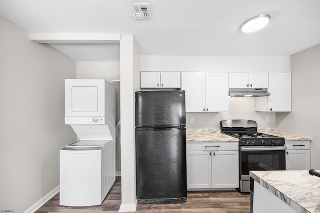 700 N Franklin Blvd Unit 1003, Pleasantville, NJ 08232 - kitchen with black appliances, under cabinet range hood, stacked washer / dryer, and dark wood finished floors
